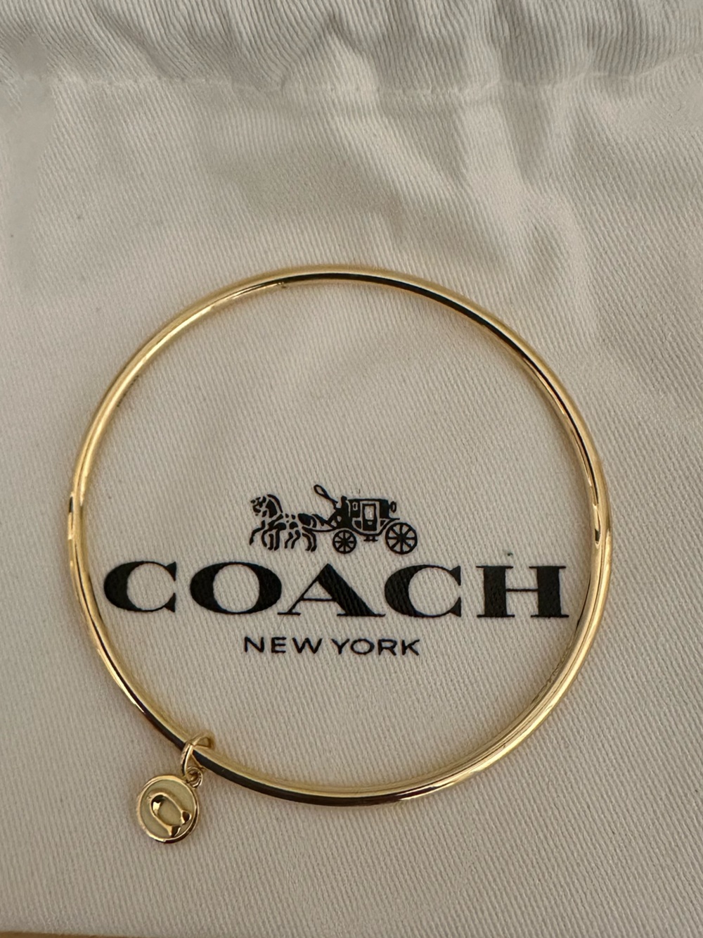 Coach Gold-tone Round Bangle with Signature Charm